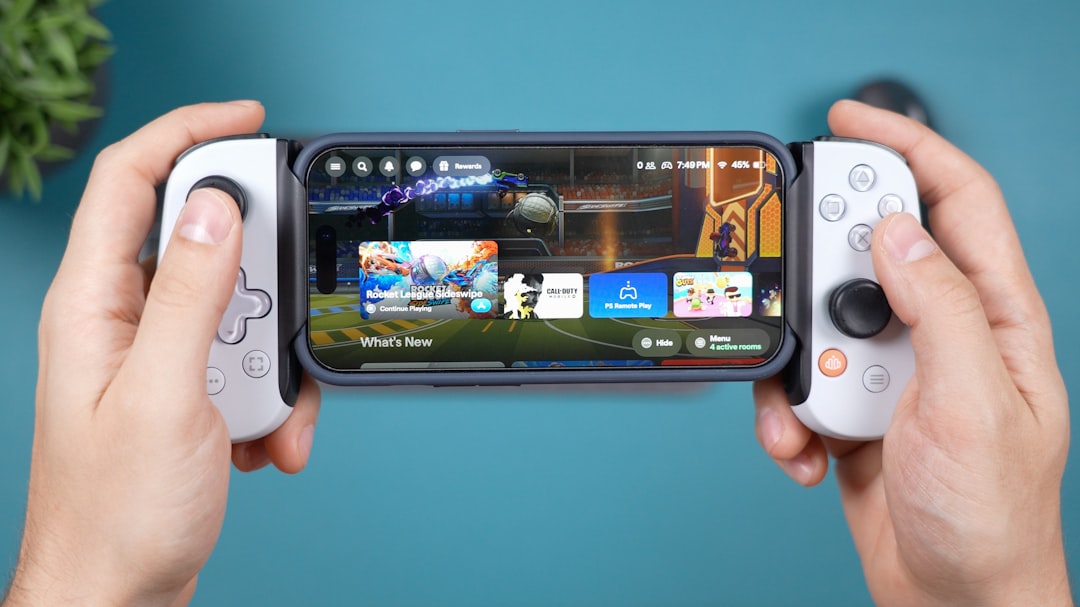 Handheld iPhone Backbone gaming controller on blue background