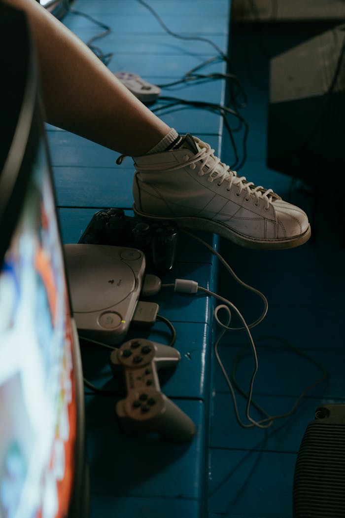 Retro gaming setup with classic console, controllers, and TV, capturing the nostalgic vibe.